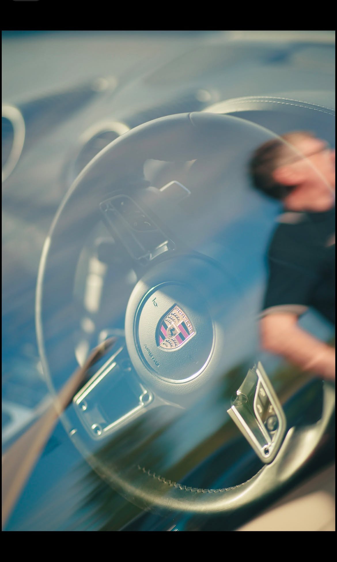 Porsche wheel, caught mid-turn